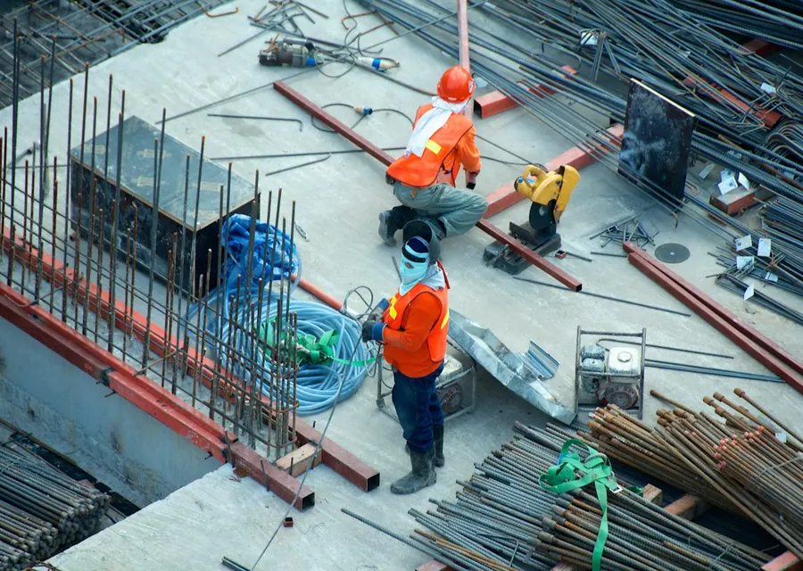 Construction workers on a building site seen from above